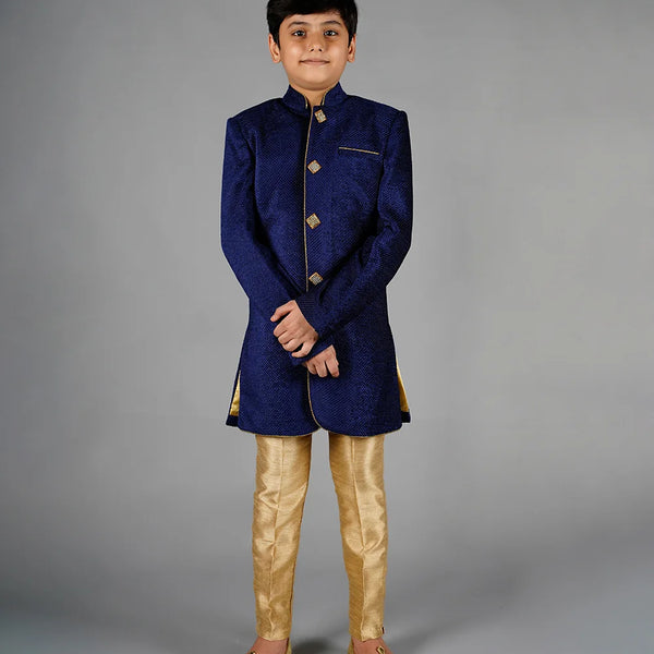 It is a beautiful navy velvet Sherwani paired up with the beige breeches pants. It comes with a stylish buttons on the Sherwani.