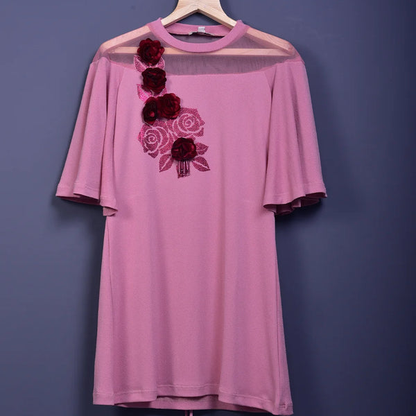 It is a pink Colored floral printed dress for girls. This dress has beautiful 3D and 2D floral detailing that uplifts the entire look.