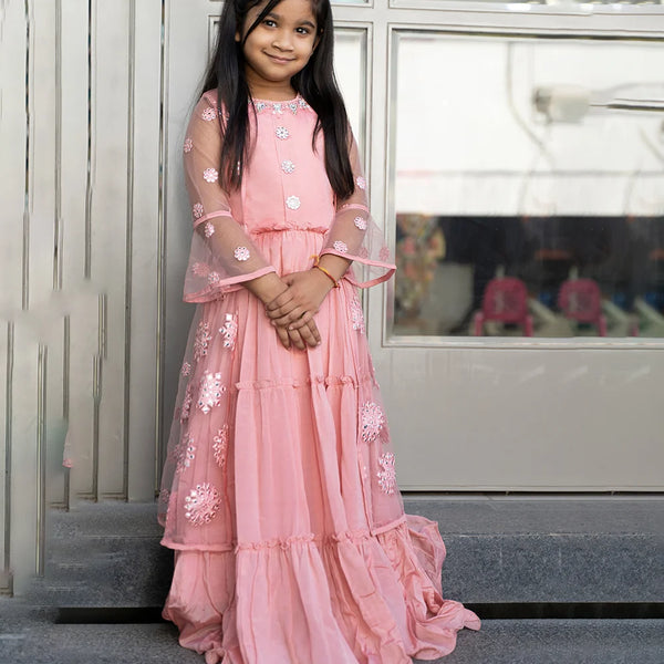 pink wedding wear gown paired with a shrug for girls 