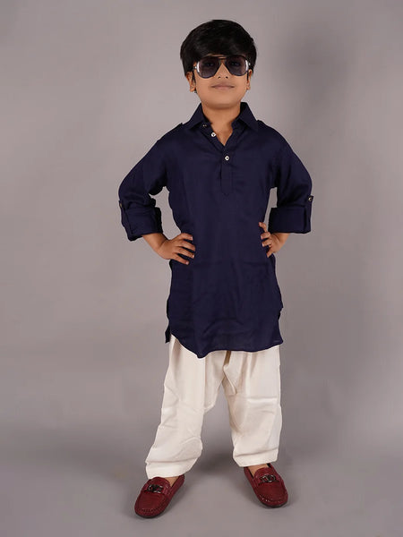 Dress up your kid in this pathani kurta pajama set. It comes with a solid navy colored full sleeves kurta and cream colored Salwar, curated from best quality cotton voile fabric.