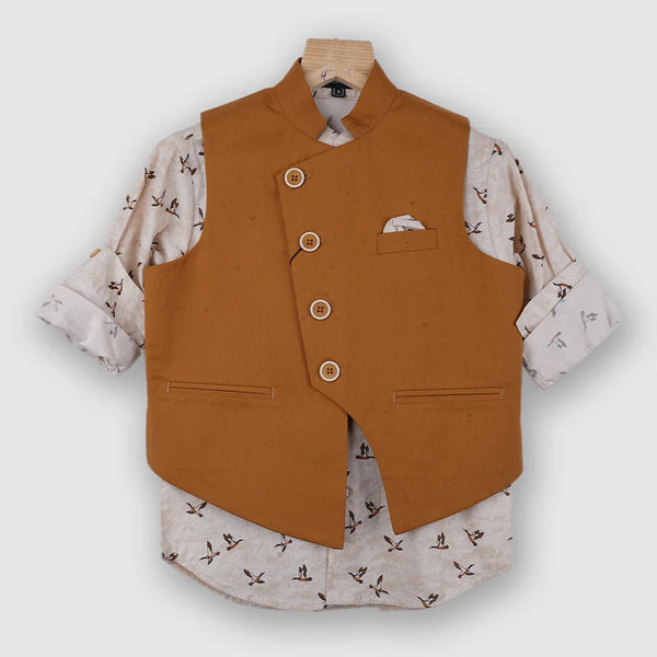 It is a beautiful mustard Color party wear waist coat set for boys. It comes with a printed shirt, a pocket square and a matching mustard Colored pant. 