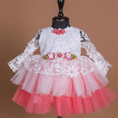 Full sleeves laced Birthday frock with floral detailing on the waist and neck.