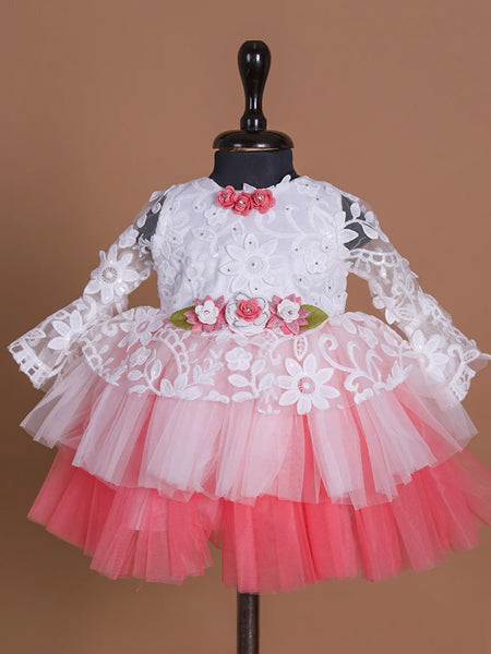 Full sleeves laced Birthday frock with floral detailing on the waist and neck.