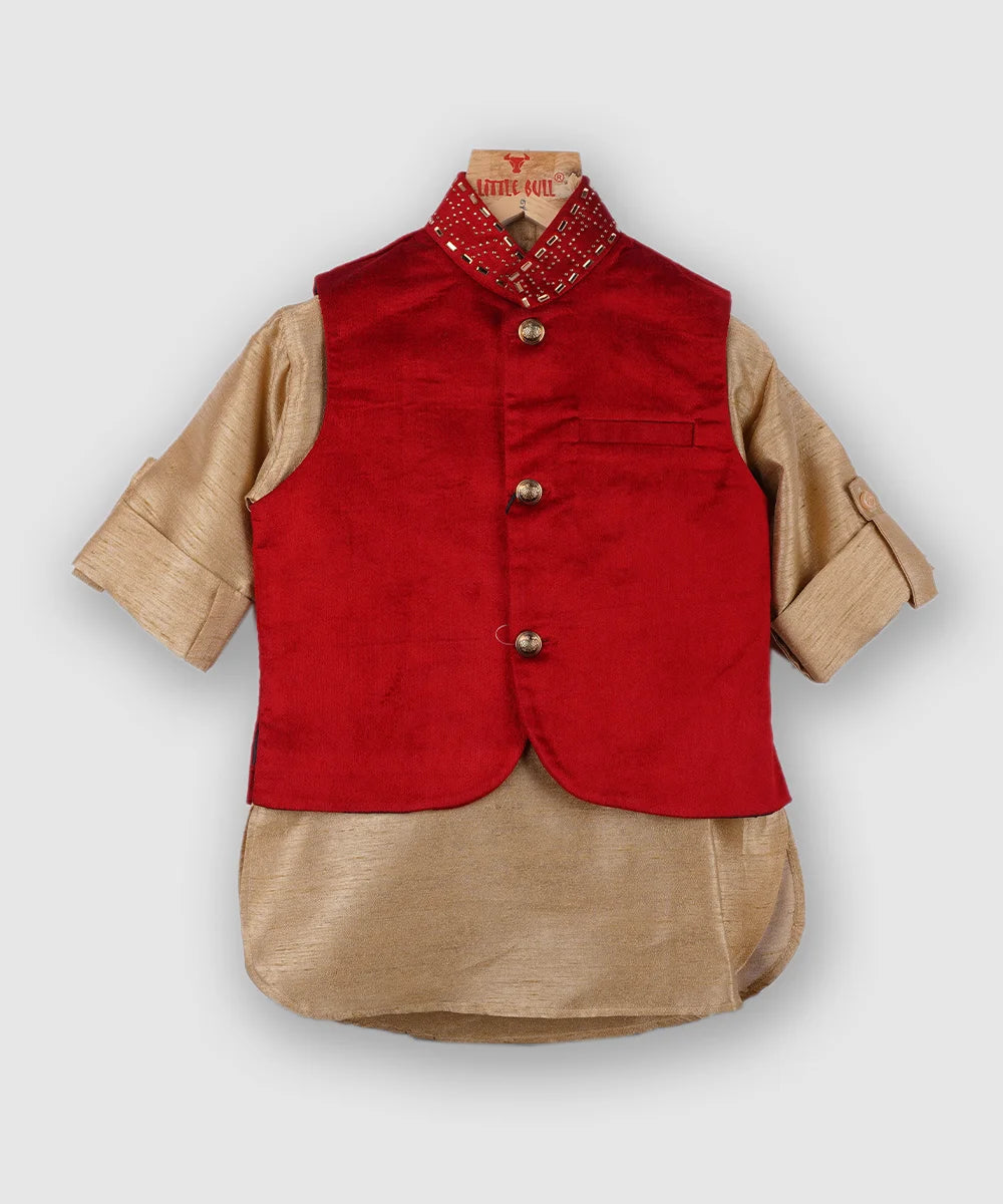 Crafted from Tussar silk material, it features a full-sleeved beige colored kurta with a stand collar neckline teamed up with a matching pajama, enhanced by the red velvet jacket. Moreover, the sleeveless jacket with work detailing on the collar and zipper detailing at the bottom side of the pajama adds to the look.