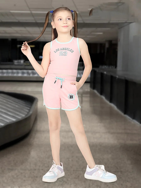 This pink Colored dress Consists of a crop top and shorts for girls perfect for summer. There is an embossed inscription on the top and shorts. Moreover the bottom comes with tie strings.