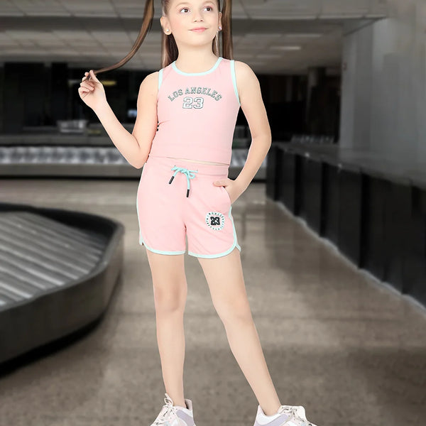 This pink Colored dress Consists of a crop top and shorts for girls perfect for summer. There is an embossed inscription on the top and shorts. Moreover the bottom comes with tie strings.