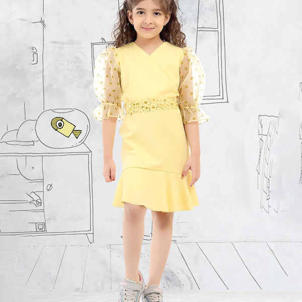 It’s a yellow party dress that comes with a back zip closure. It features polka dots on the sleeves and a matching floral belt.
