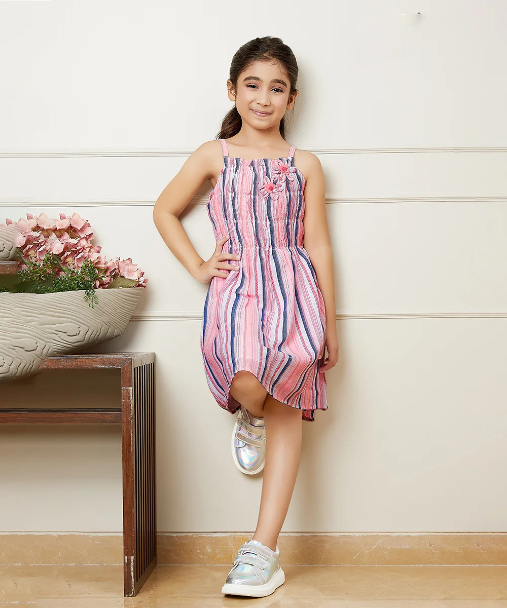 It is a multi Colored Self-Striped dress for girls and it comes with floral detailing on it.