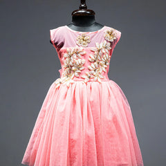 Peach Colored frock that comes with a zip closure at the back and with floral applique work in front.