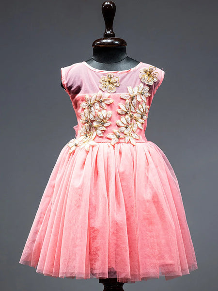 Peach Colored frock that comes with a zip closure at the back and with floral applique work in front.