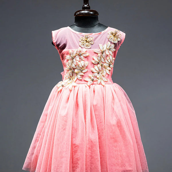 Peach Colored frock that comes with a zip closure at the back and with floral applique work in front.