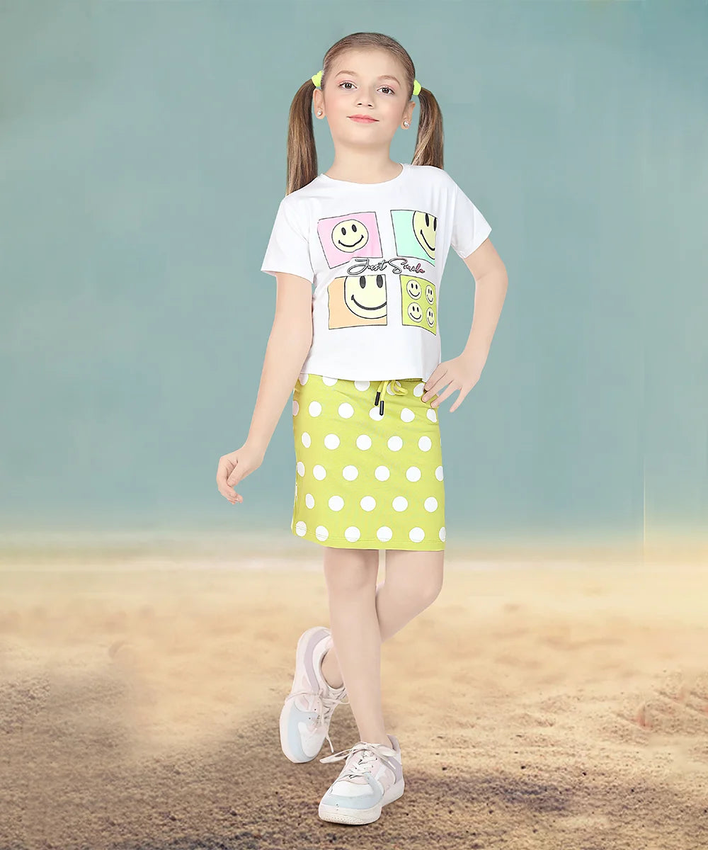 It Consists of a white coloured top and neon green Colored polka-dotted skirt for girls. A Great option as a kids birthday wear. The top comes with a shimmer smiley print and embossed inscription. While the Skirt comes with an elasticated waist and tie-string belt.