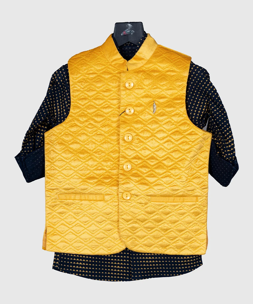 It's a yellow Colored self-textured waistcoat set. Crafted in a sleeveless style, it features a cute broach and two hand pockets for a classic look. It is paired up with the printed navy Colored shirt.