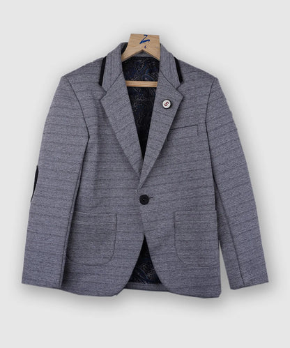 It is a beautiful steel grey color textured blazer for your kid boy. It features a stylized button on a classic notch lapel collar and a patch elbow detailing on the sleeves.