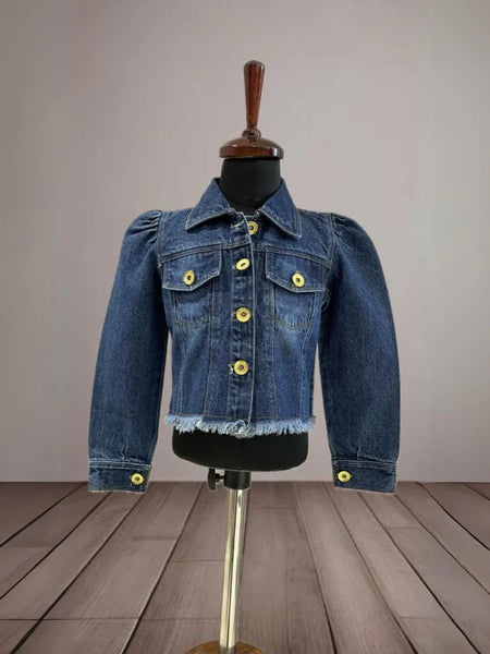 It's a blue denim jacket for baby girls with power shoulder detailing that uplifts the entire look.