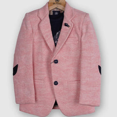 It is a beautiful light pink color, textured blazer that features a cute broach and a patch elbow detailing on the sleeves. It comes with a matching half sleeves round neck blue Colored t-shirt.