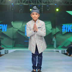 It is a beautiful steel-colour self-embroidery Sherwani for a wedding function for boys paired up with a navy colour Churidar Pyjama.