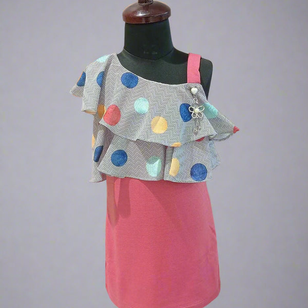 It’s a straight fit pink and grey Colored trendy dresses for kids that comes with a polka-dotted ruffled neck for party looks.  It features a beautiful broach and a back zip closure.