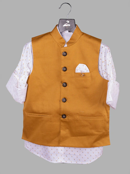 Let your kid walk in style by wearing this amazing mustard Colored waistcoat set for boys. It is a cut-sleeve waistcoat for boys paired up with a printed white Colored shirt.