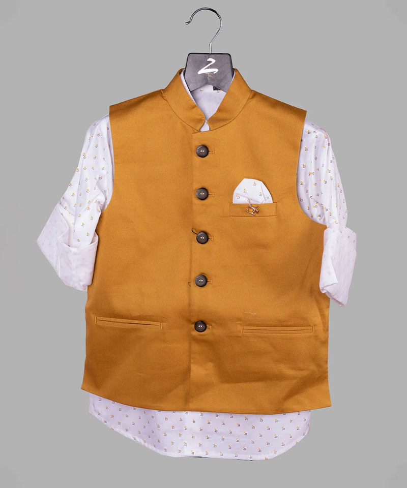 Let your kid walk in style by wearing this amazing mustard Colored waistcoat set for boys. It is a cut-sleeve waistcoat for boys paired up with a printed white Colored shirt.