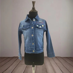 It's a blue denim jacket for kid girls with an inscription and cute small floral detailing that uplifts the entire look.
