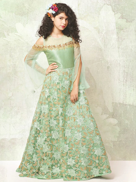 It’s a Pista green Colored party gown that comes with a back zip closure. It features sequin and cut Dana work detailing. Moreover, it also has a fabric belt to be tied at the back.