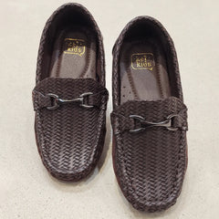 Pair of brown woven loafers on a light gray background