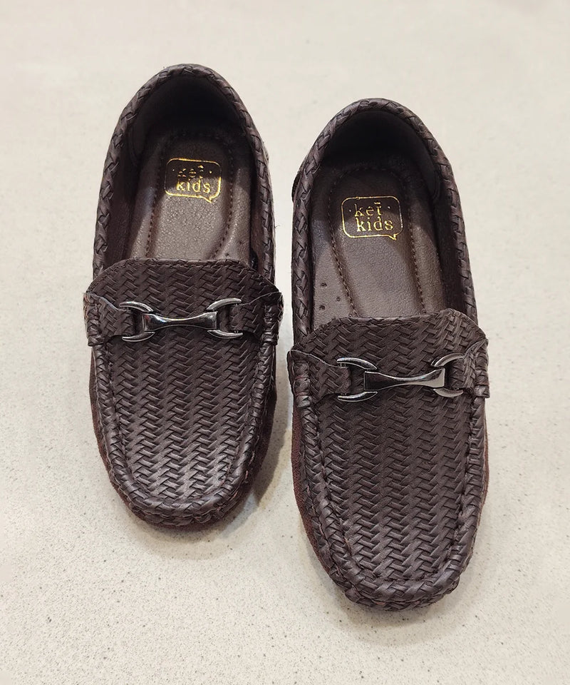 Pair of brown woven loafers on a light gray background