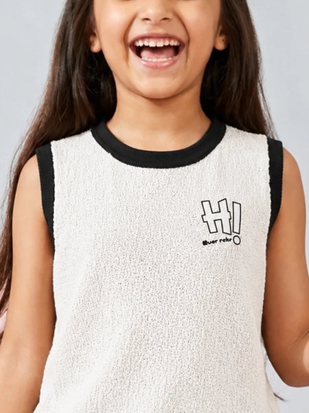 Child wearing a white sleeveless shirt with black trim and 'HI!' print on a gray background