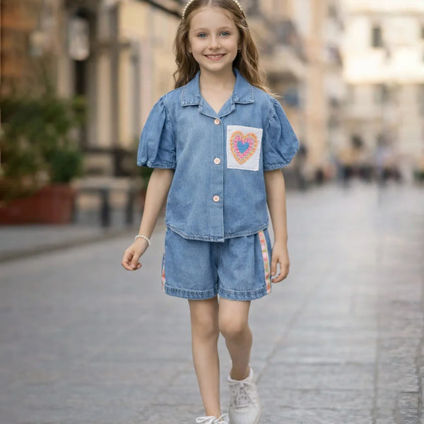 Young girl in a denim outfit walking on a street.