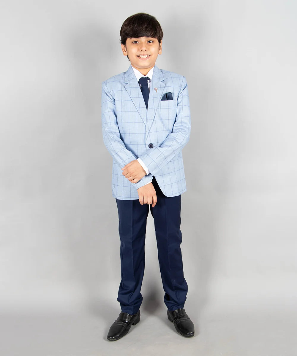 This suit set comes with a checkered blazer, a white shirt, a navy waistcoat and trousers for boys. In addition to that, it is teamed up with a cute broach and a navy blue pocket square.