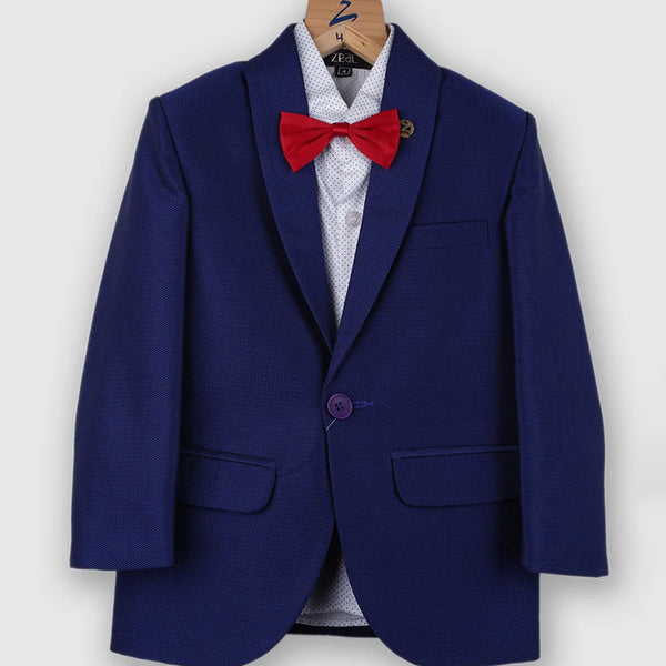 The creation is paired with a beautiful dotted white shirt, a red bow and straight trousers. It features a self-textured blazer with a nice small broach on it.