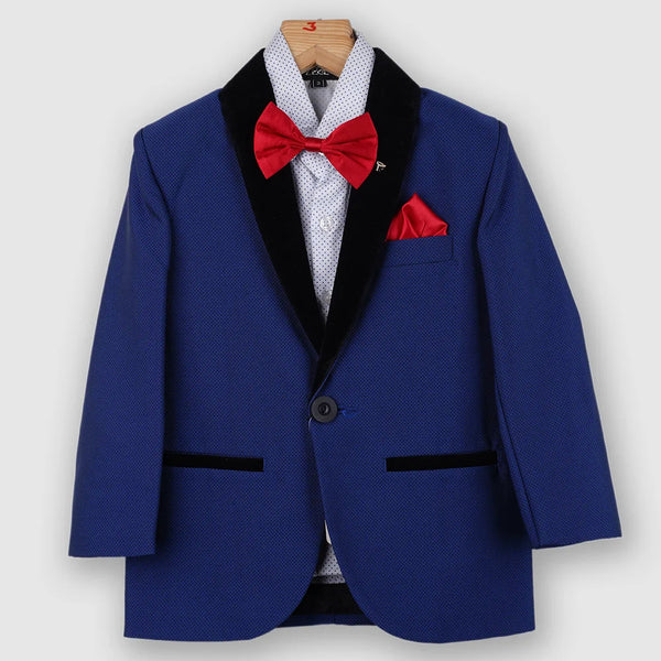 The creation is paired with a beautiful dotted white shirt, a red bow and straight trouser pants. It features a self-textured blazer with a nice small broach on its collar that’s created from a velvet fabric.