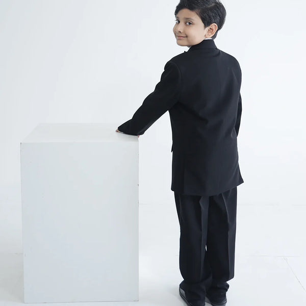 back view of black shimmer coat suit set for boys