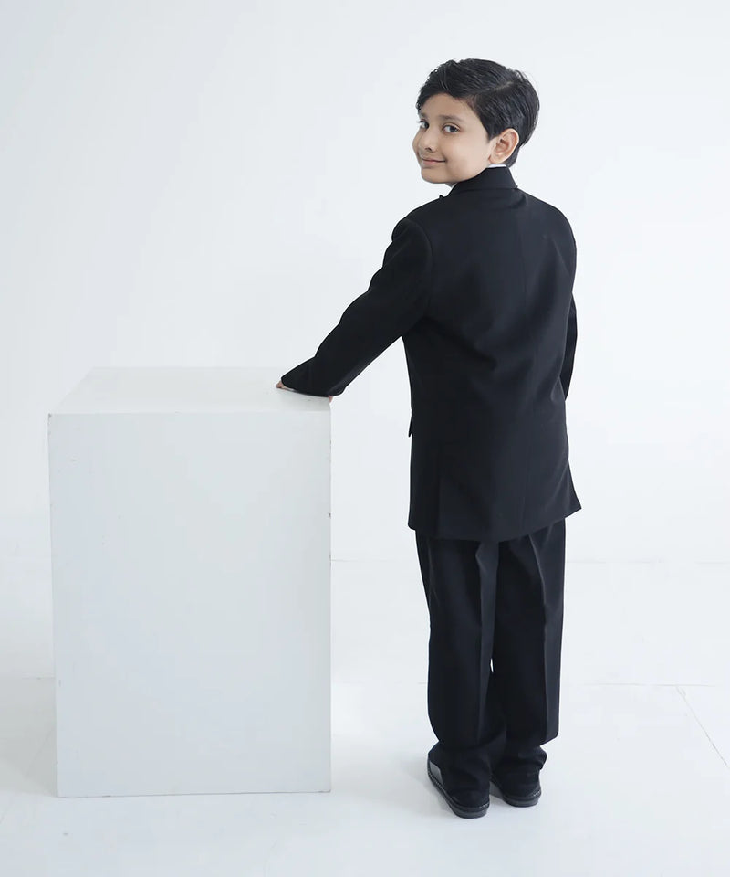 back view of black shimmer coat suit set for boys