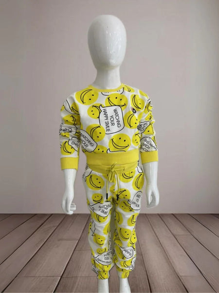 It is a yellow-coloured co-ord set for baby girls. It features a smiley print and the bottom comes with tie-string detailing.