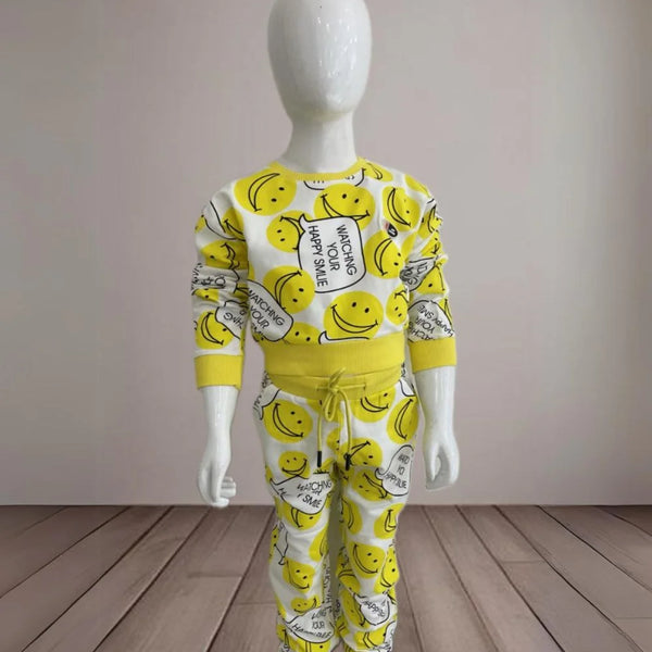 It is a yellow-coloured co-ord set for baby girls. It features a smiley print and the bottom comes with tie-string detailing.