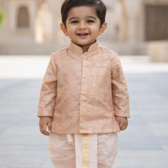 Child wearing a traditional outfit with a blurred architectural background