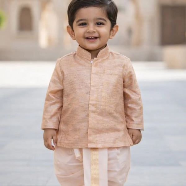 Child wearing a traditional outfit with a blurred architectural background