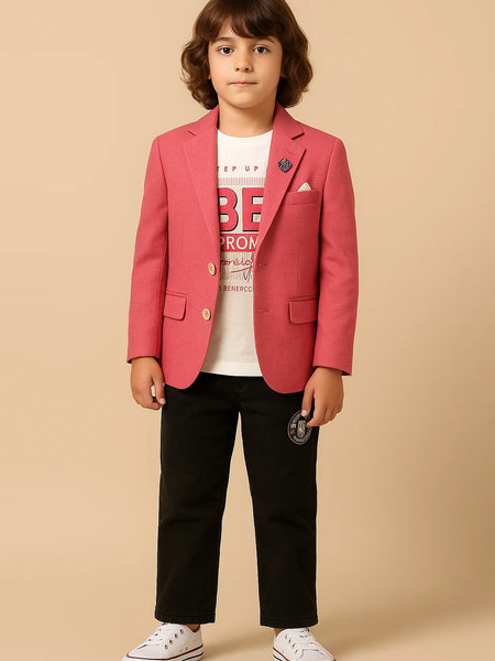 Child wearing a red blazer over a white shirt with text, black pants, and white sneakers on a beige background