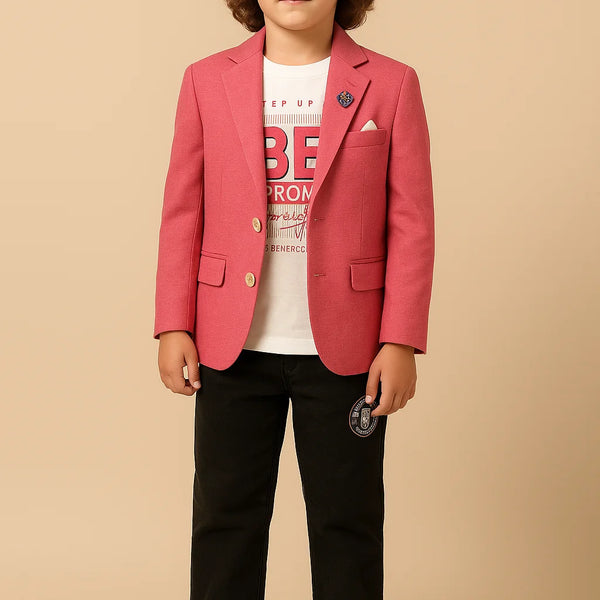 Child wearing a red blazer over a white shirt with text, black pants, and white sneakers on a beige background