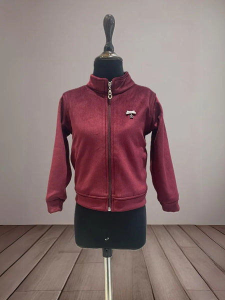 It is a maroon Colored self-striped jacket that comes with cute broach detailing. It is the best kids wear.