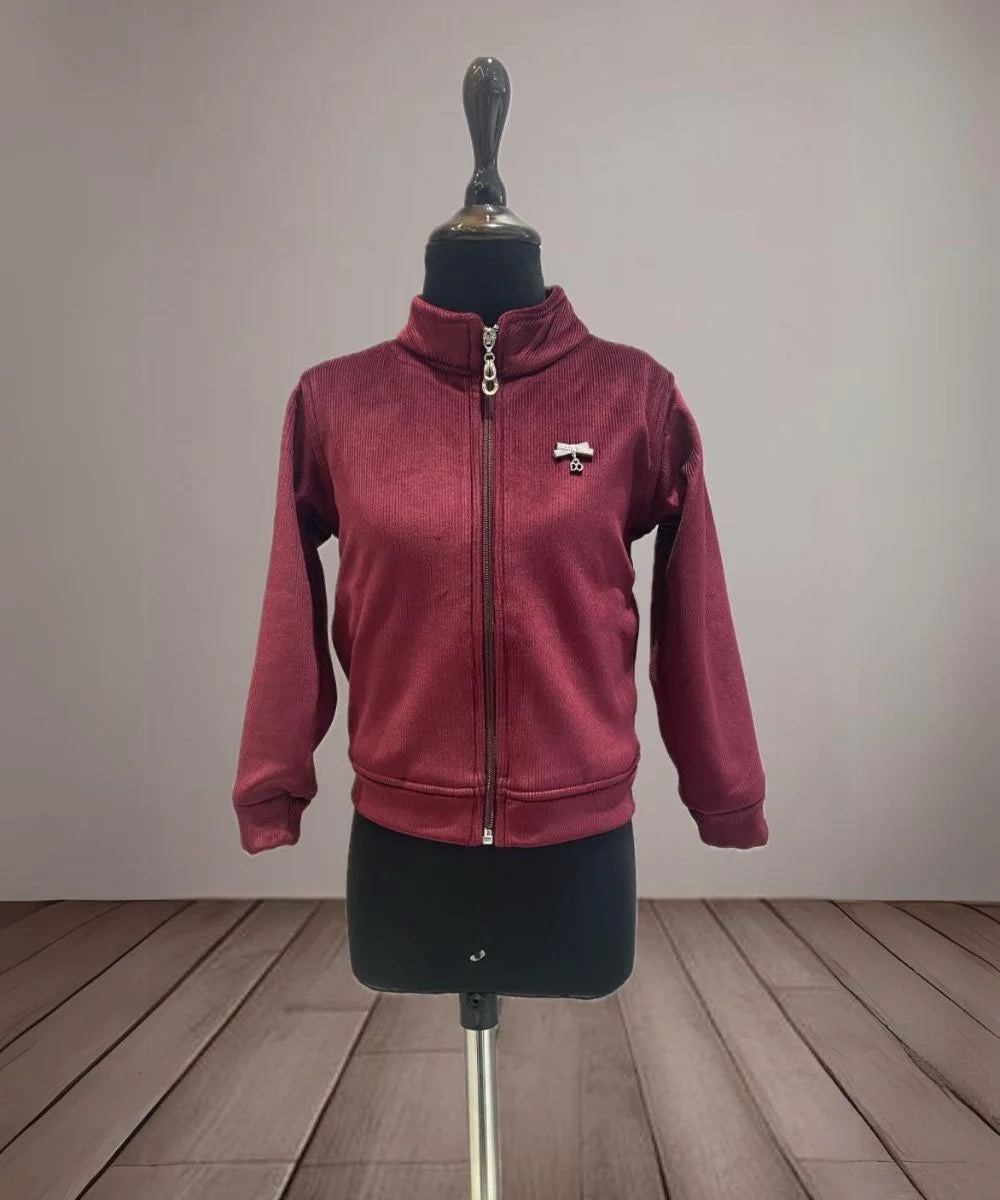 It is a maroon Colored self-striped jacket that comes with cute broach detailing. It is the best kids wear.