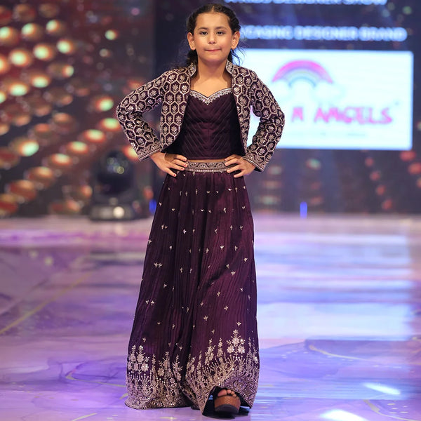 Young model in a dark purple lehenga with star patterns 