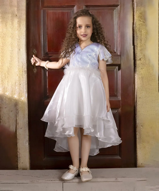 It's a cute white coloured up-and-down birthday frock with a back zip closure. A perfect marriage wears for girls. It features a bow on the back and beautiful feather detailing on the waist that uplifts the entire look.
