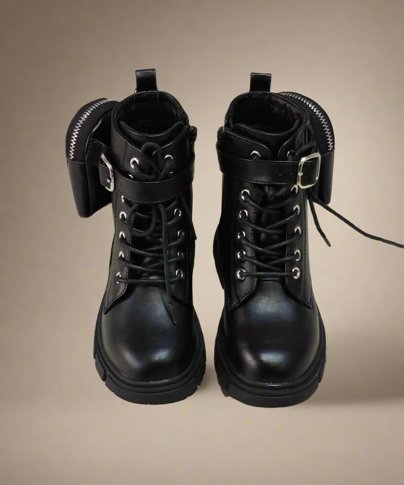 Close-up of girls' black ankle boots with removable pouch and rugged design, perfect for winter in Jaipur