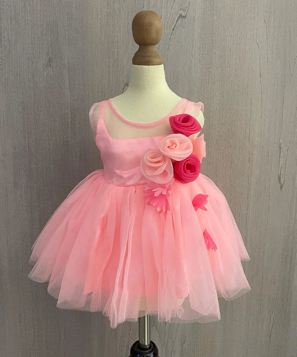 It's a peach colored frock that comes with a back zip closure and features the cute floral detailing.