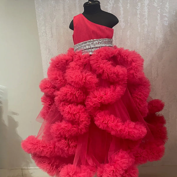 It’s a fancy pink ruffle gown that comes with a side zip closure and is a perfect children birthday dress. It features pleated and sequin fabric detailing that uplifts the entire look.