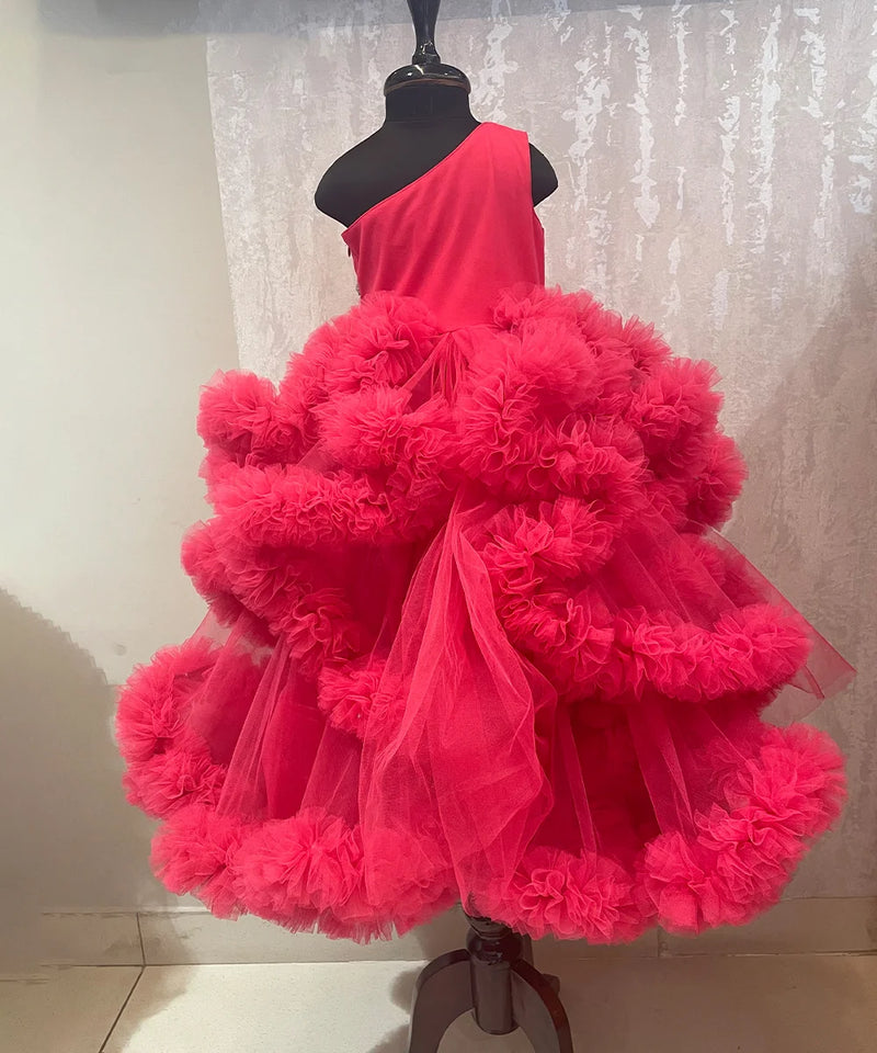 back view of pink one shoulder ruffled gown for girls 