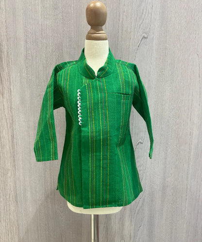  It is a green colored self-embroidered traditional kurta for boys that comes with a matching white dhoti.